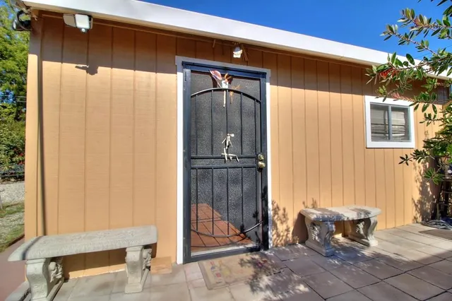 a bedroom with furniture and a chandelier