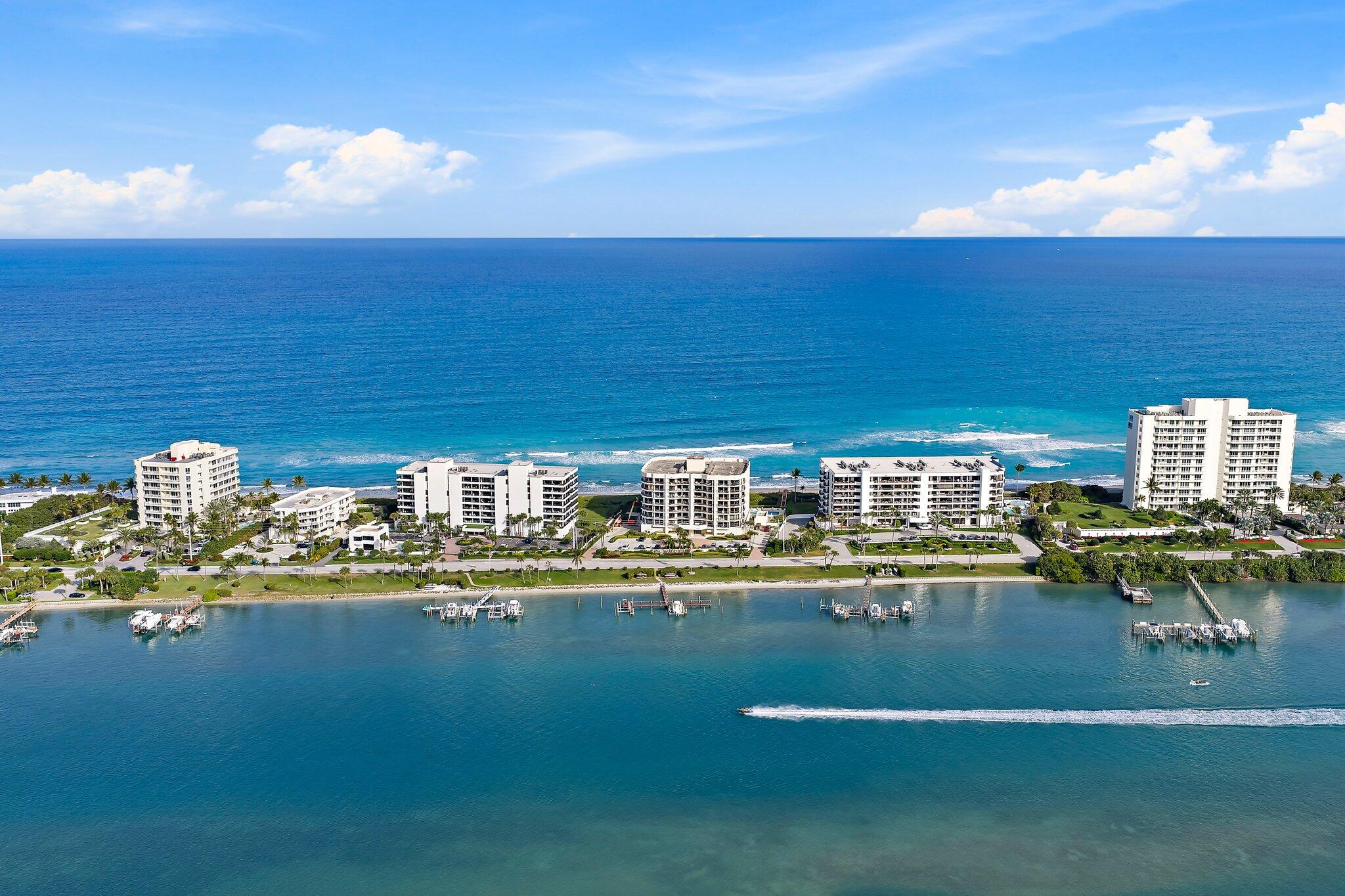 19850 South Beach Road, Unit 3D Jupiter, FL 33469 - Photo 2 of 54 a view of swimming pool with outdoor seating and yard