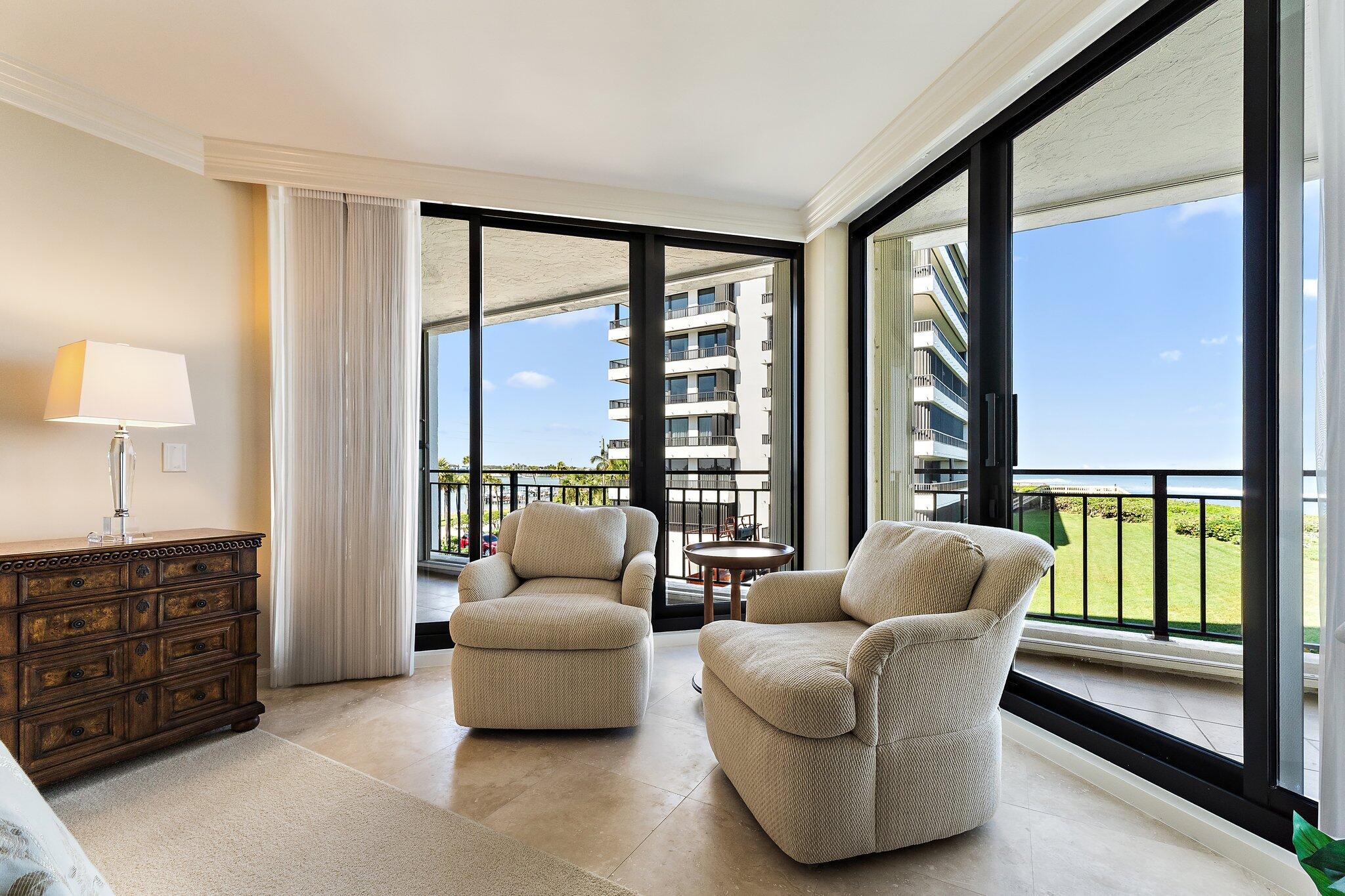 19850 South Beach Road, Unit 3D Jupiter, FL 33469 - Photo 30 of 54 a living room with furniture and a large window