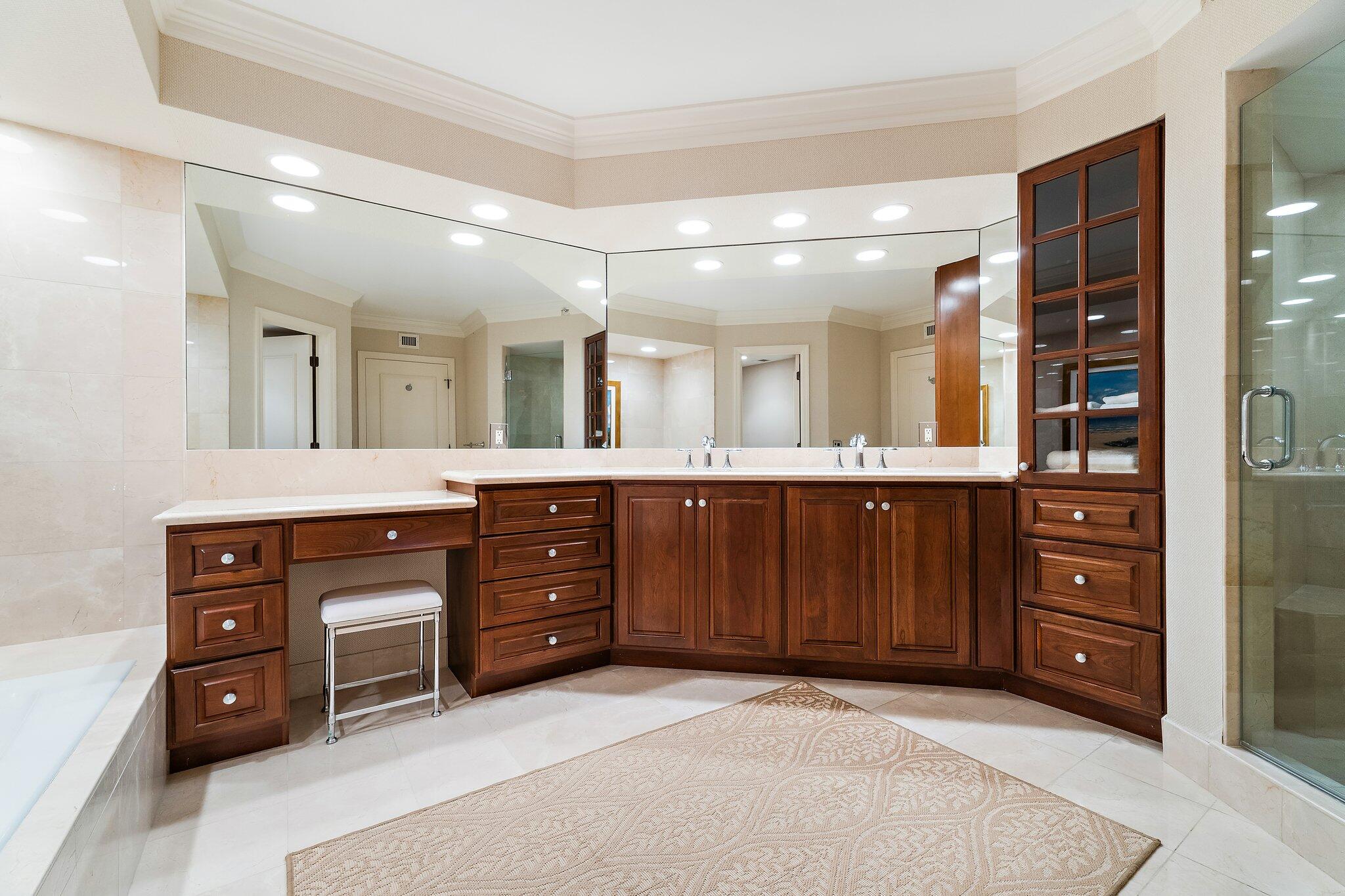 19850 South Beach Road, Unit 3D Jupiter, FL 33469 - Photo 35 of 54 a spacious bathroom with a granite countertop sink and a mirror