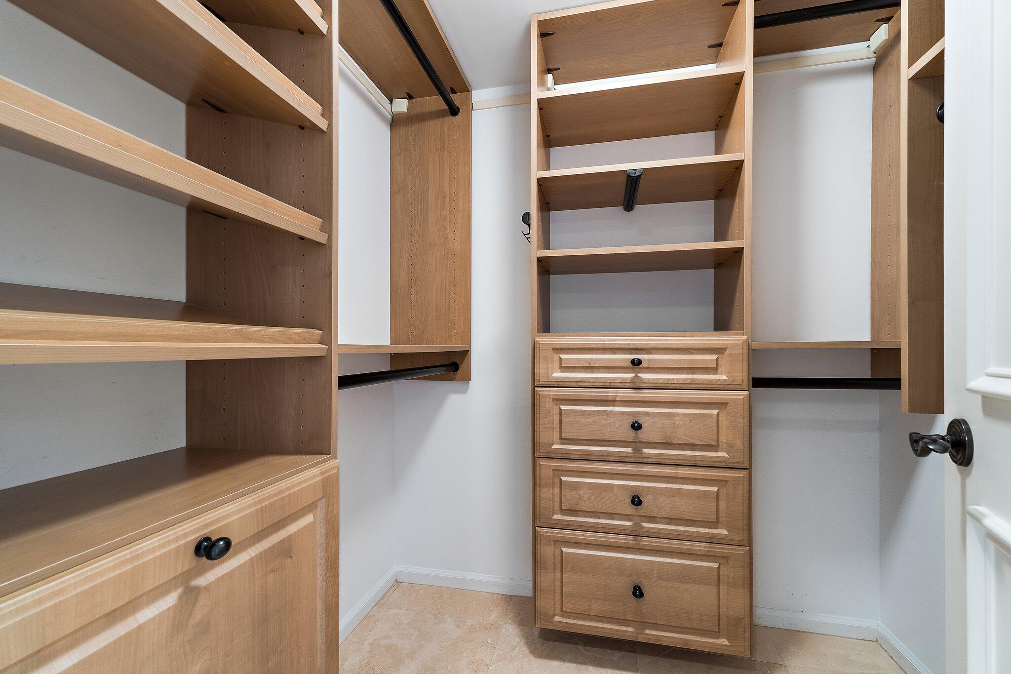 19850 South Beach Road, Unit 3D Jupiter, FL 33469 - Photo 37 of 54 a view of walk in closet with empty racks