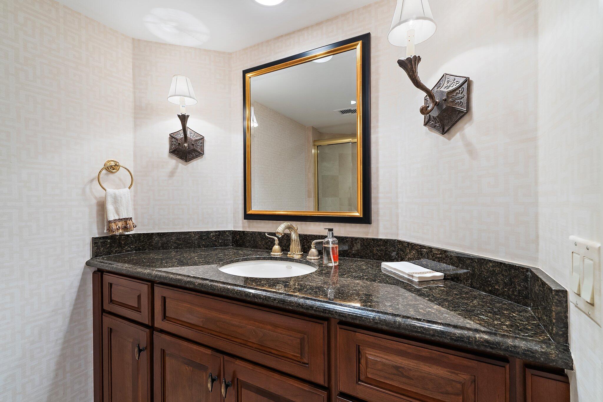 19850 South Beach Road, Unit 3D Jupiter, FL 33469 - Photo 42 of 54 a bathroom with a sink and a mirror