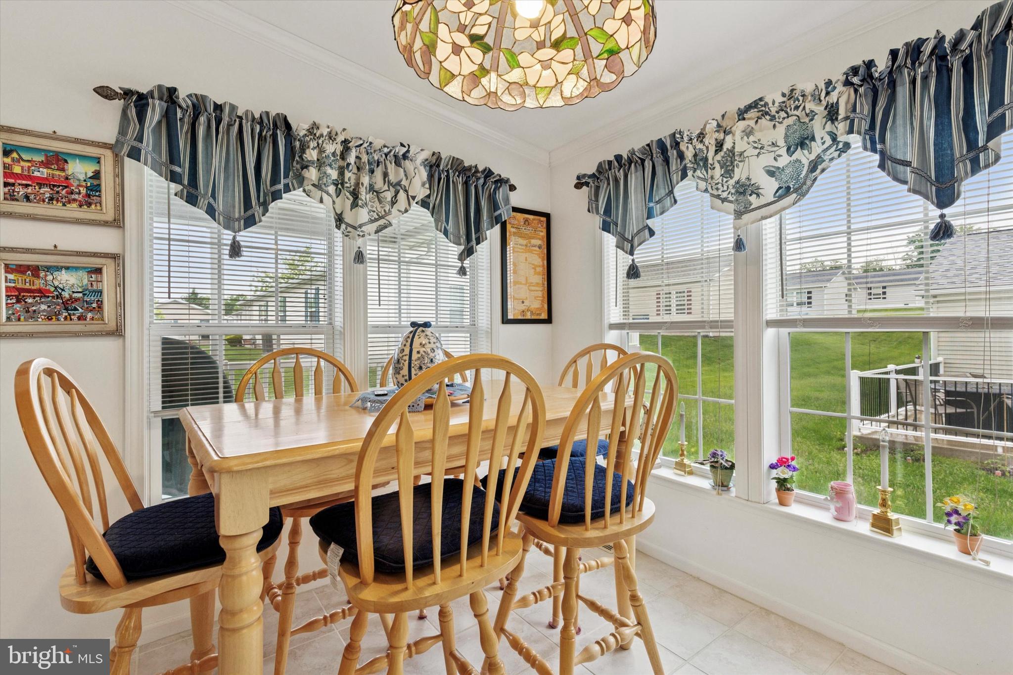 81 Random Road Douglassville, PA 19518 - Photo 16 of 31 a view of a dining room with furniture wooden floor and a chandelier