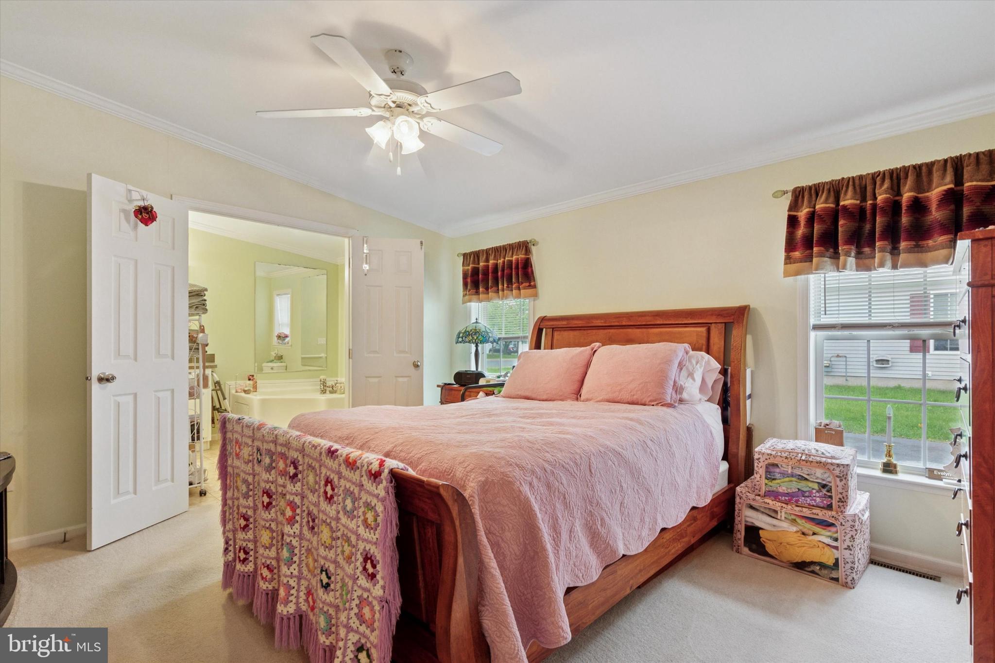 81 Random Road Douglassville, PA 19518 - Photo 19 of 31 a bedroom with a bed a window and a chandelier