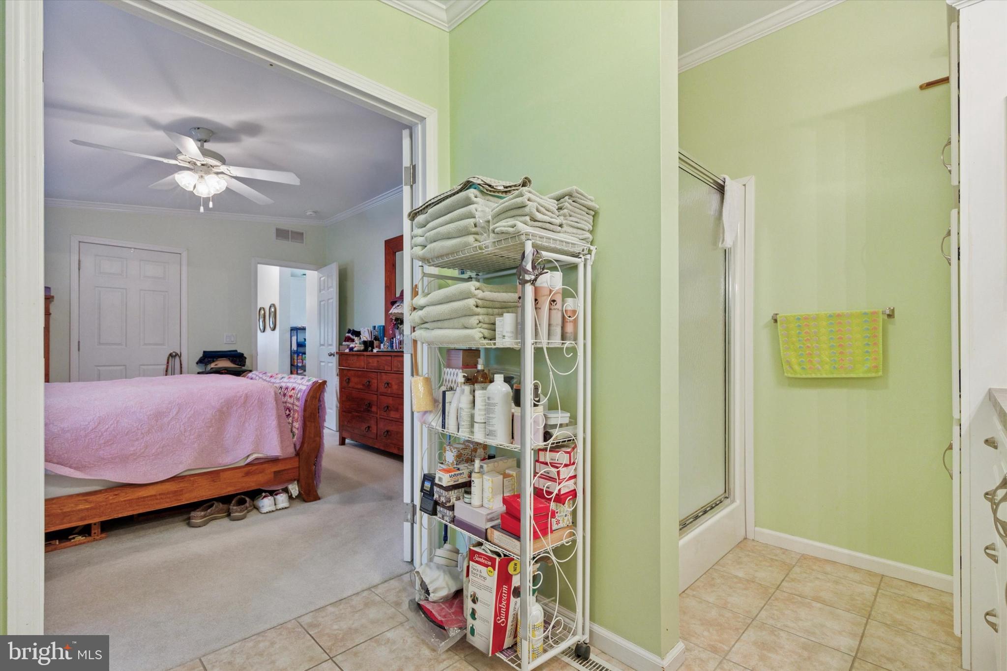 81 Random Road Douglassville, PA 19518 - Photo 22 of 31 a bedroom with bed and a chandelier