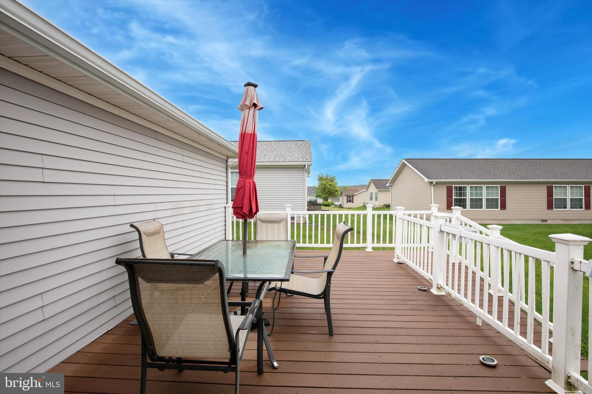 81 Random Road Douglassville, PA 19518 - Photo 26 of 31 a view of a house with wooden deck and furniture