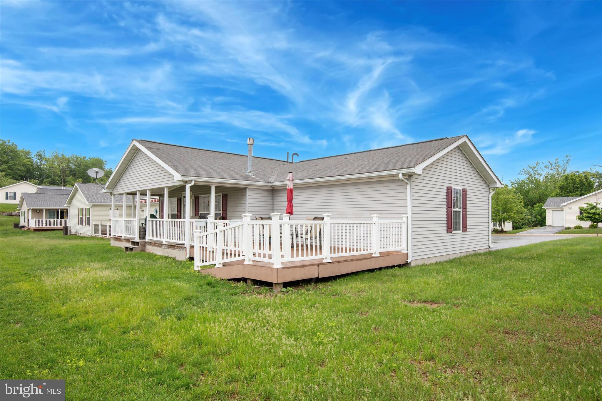 81 Random Road Douglassville, PA 19518 - Photo 28 of 31 a view of a house with a yard and deck
