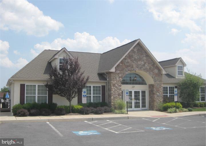 81 Random Road Douglassville, PA 19518 - Photo 30 of 31 front view of a brick house with a yard