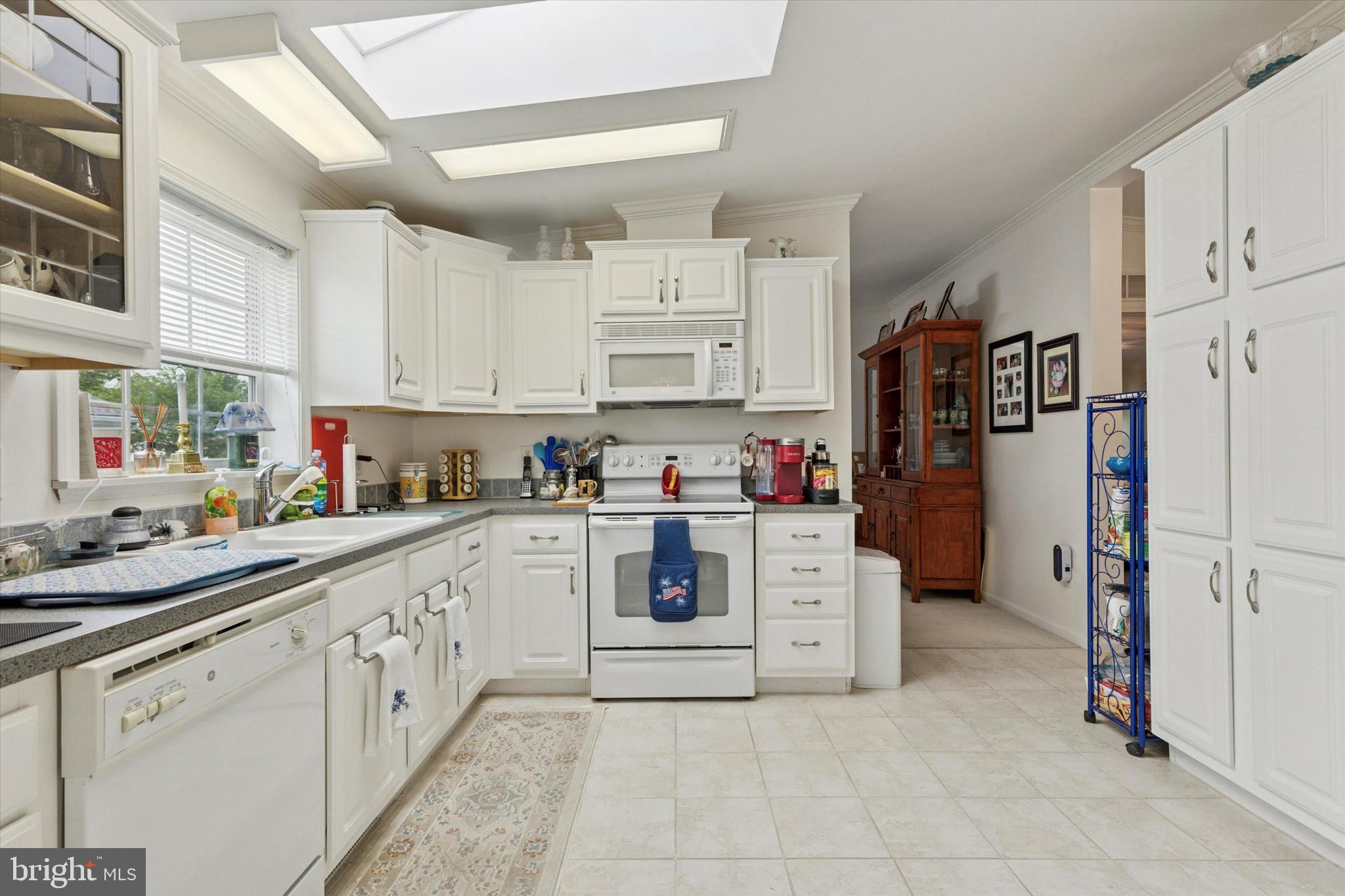 81 Random Road Douglassville, PA 19518 - Photo 10 of 31 a kitchen with stainless steel appliances a refrigerator sink and cabinets