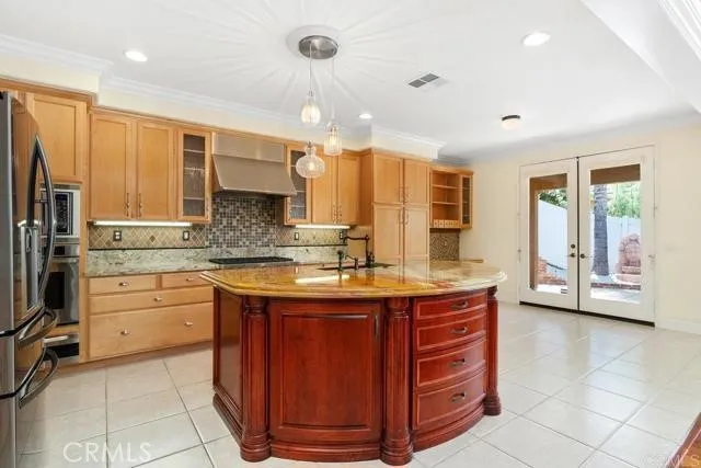 a kitchen with stainless steel appliances granite countertop a sink and cabinets
