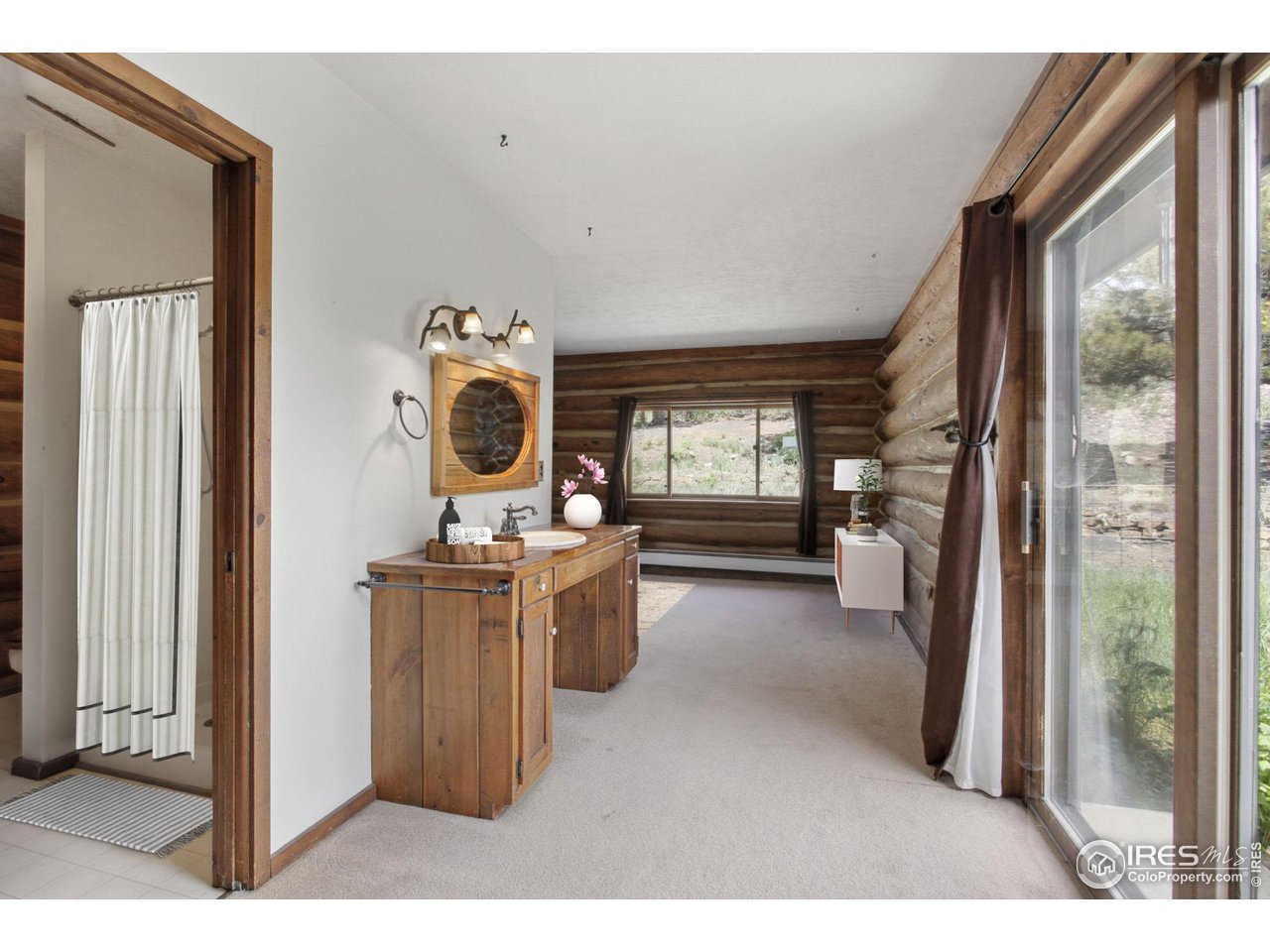 2657 Parrish Road Berthoud, CO 80513 - Photo 13 of 40 Main level primary bedroom with walkout