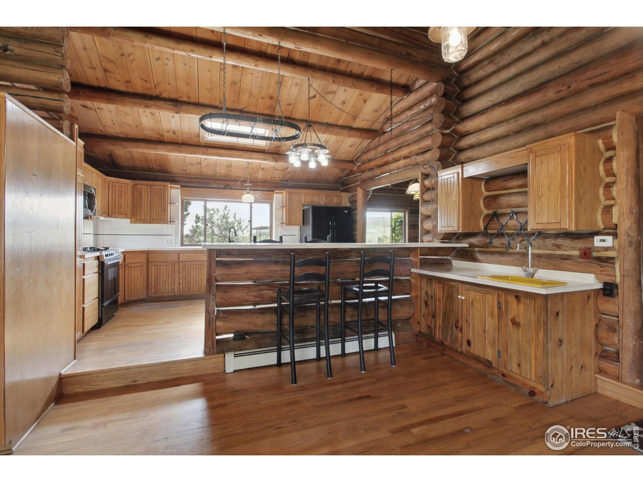 2657 Parrish Road Berthoud, CO 80513 - Photo 8 of 40 From dining room, showing kitchen and bar sink