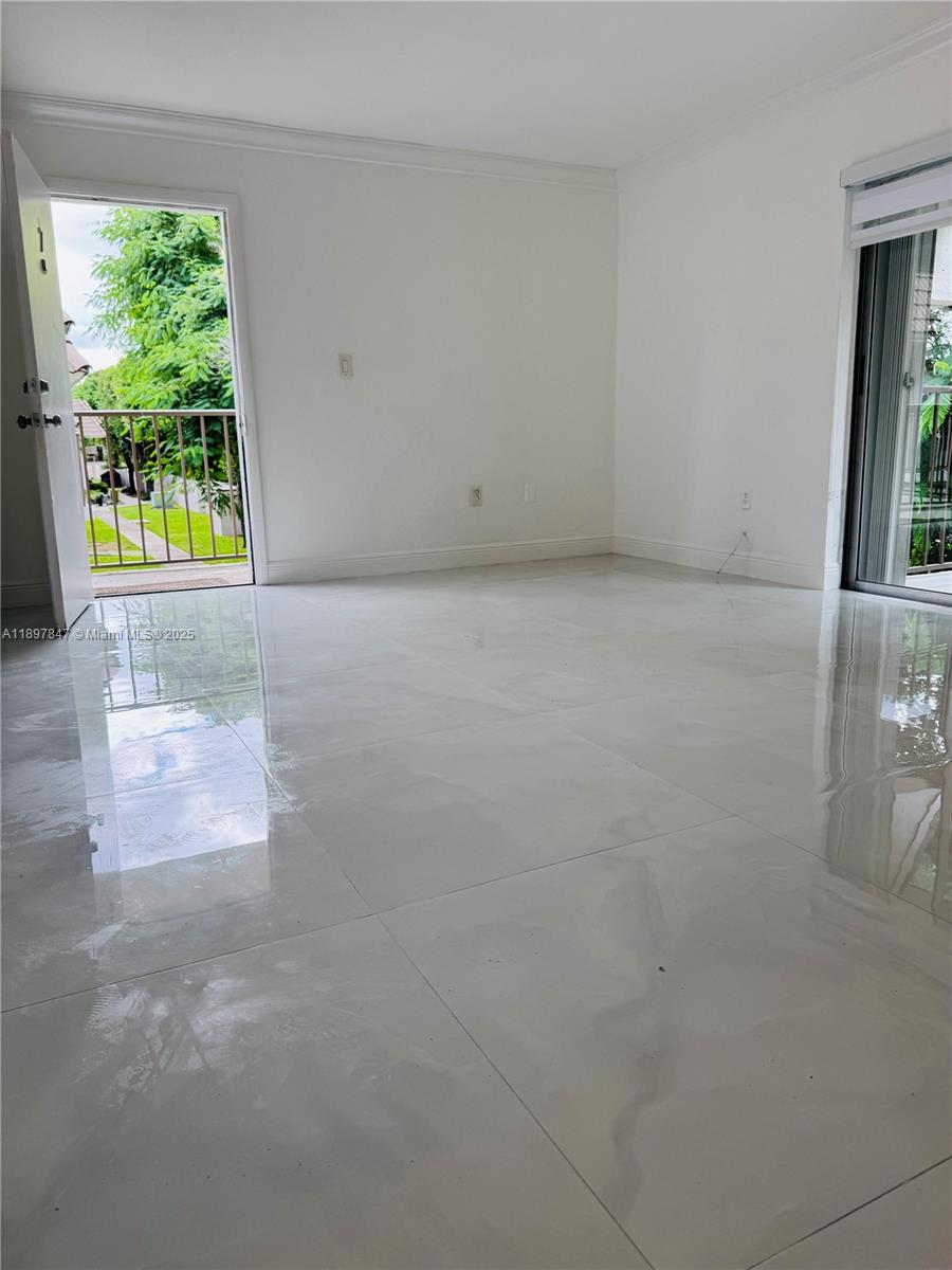 6961 Southwest 129th Avenue, Unit 7 Miami, FL 33183 - Photo 11 of 42 an empty room with windows