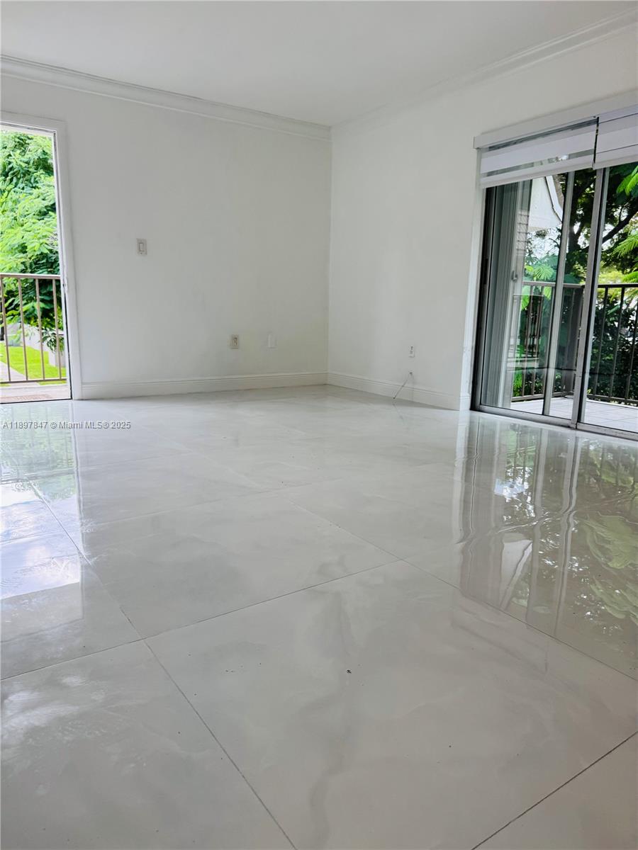6961 Southwest 129th Avenue, Unit 7 Miami, FL 33183 - Photo 12 of 42 a view of an empty room with a window