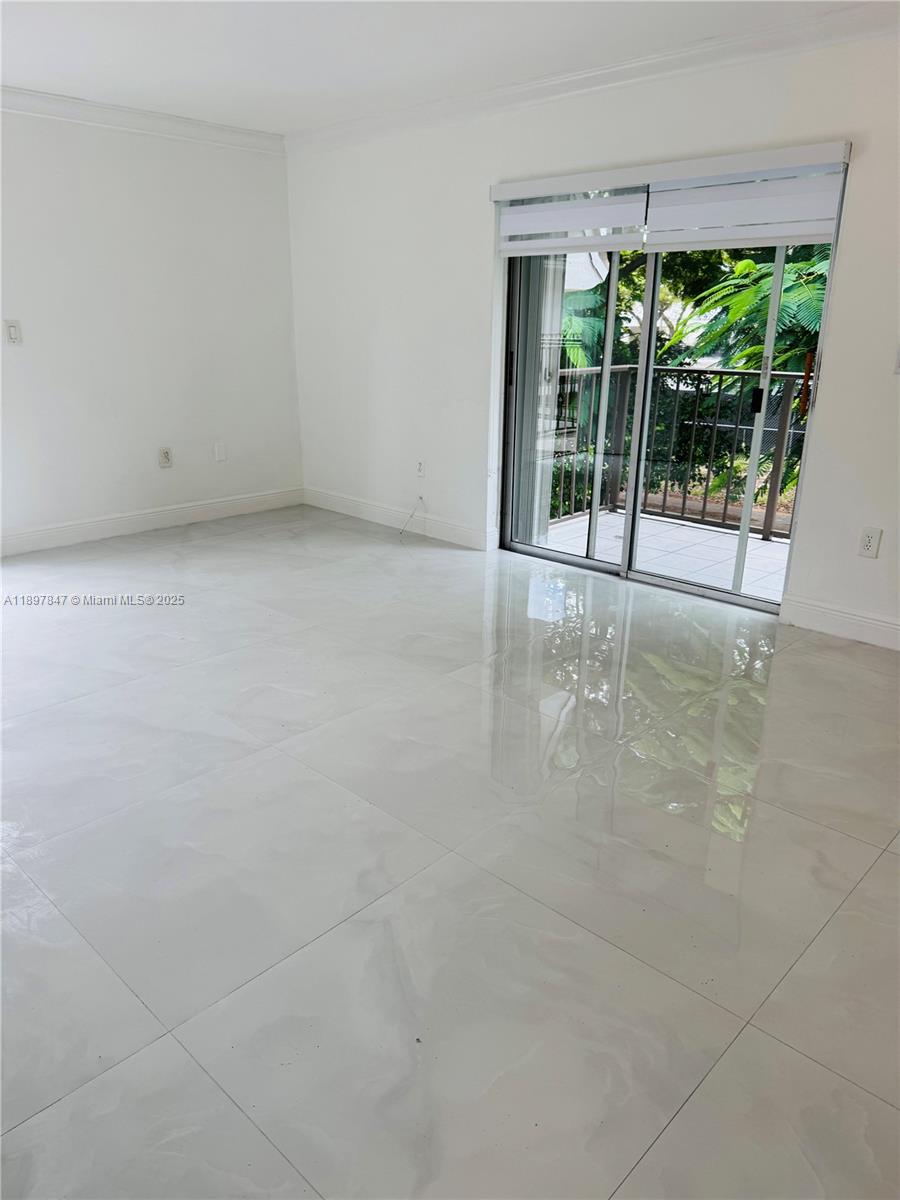 6961 Southwest 129th Avenue, Unit 7 Miami, FL 33183 - Photo 15 of 42 a view of an empty room with a window