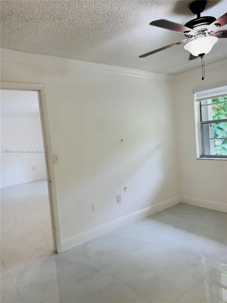 6961 Southwest 129th Avenue, Unit 7 Miami, FL 33183 - Photo 22 of 42 en empty room with windows