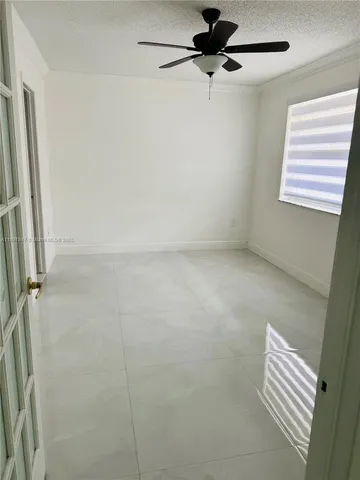 a bathroom with a shower and a window