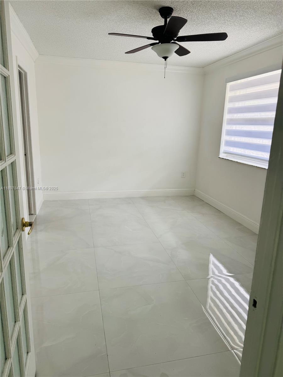 6961 Southwest 129th Avenue, Unit 7 Miami, FL 33183 - Photo 25 of 42 a bathroom with a shower and a window