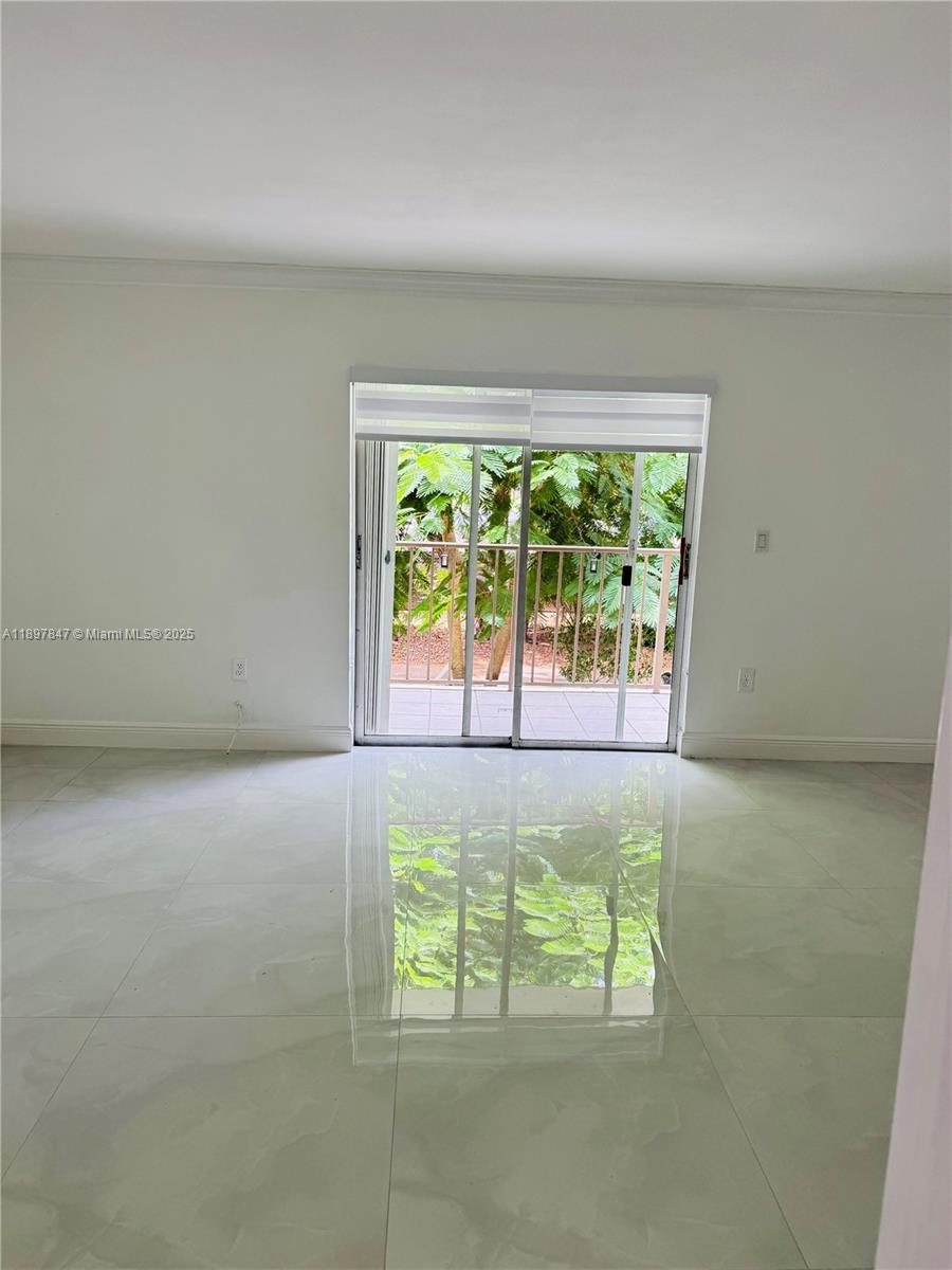 6961 Southwest 129th Avenue, Unit 7 Miami, FL 33183 - Photo 3 of 42 an empty room with windows