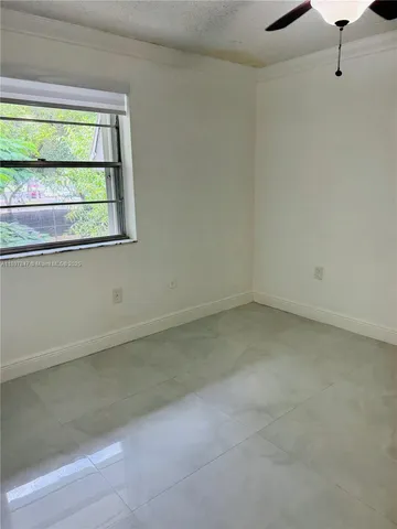 a view of an empty room with a balcony