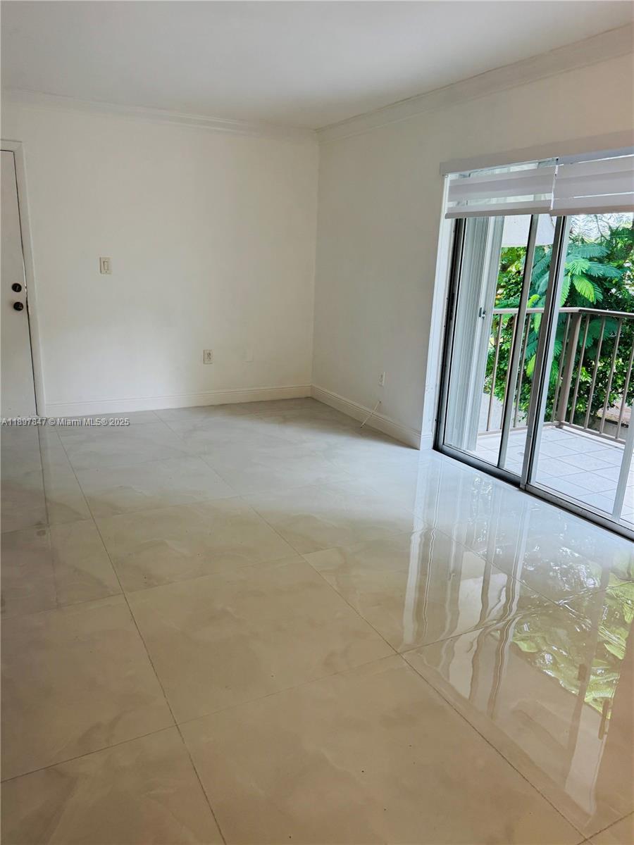 6961 Southwest 129th Avenue, Unit 7 Miami, FL 33183 - Photo 35 of 42 a view of an empty room with a balcony