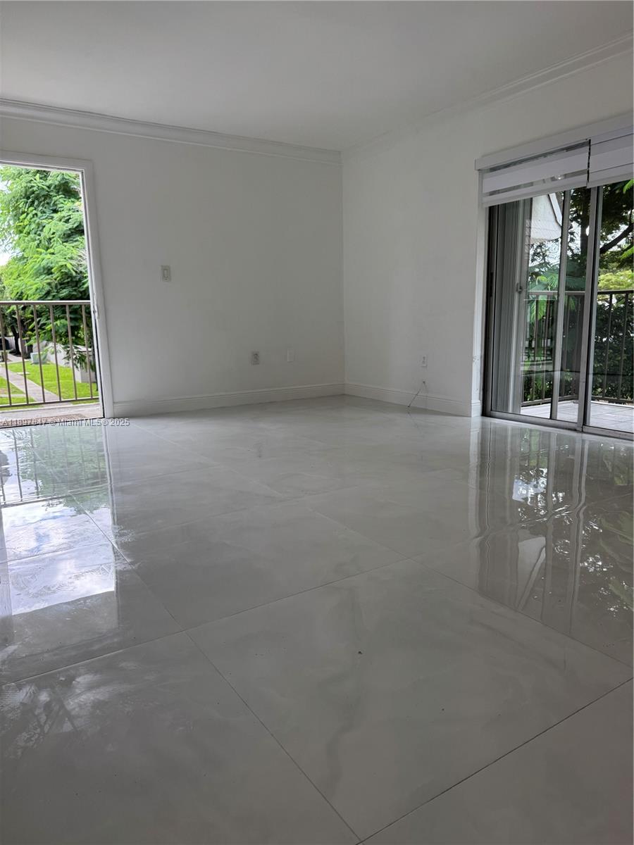 6961 Southwest 129th Avenue, Unit 7 Miami, FL 33183 - Photo 37 of 42 a view of an empty room with a window