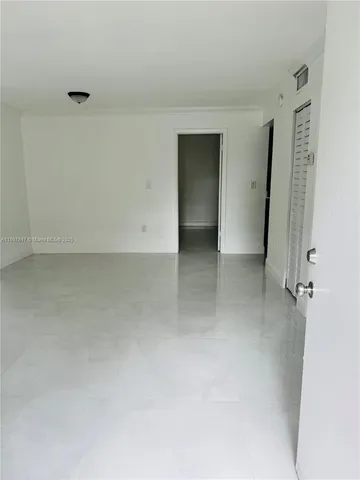 wooden floor and cabinet in an empty room