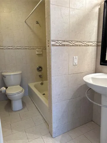 a bathroom with a toilet sink and a bathtub