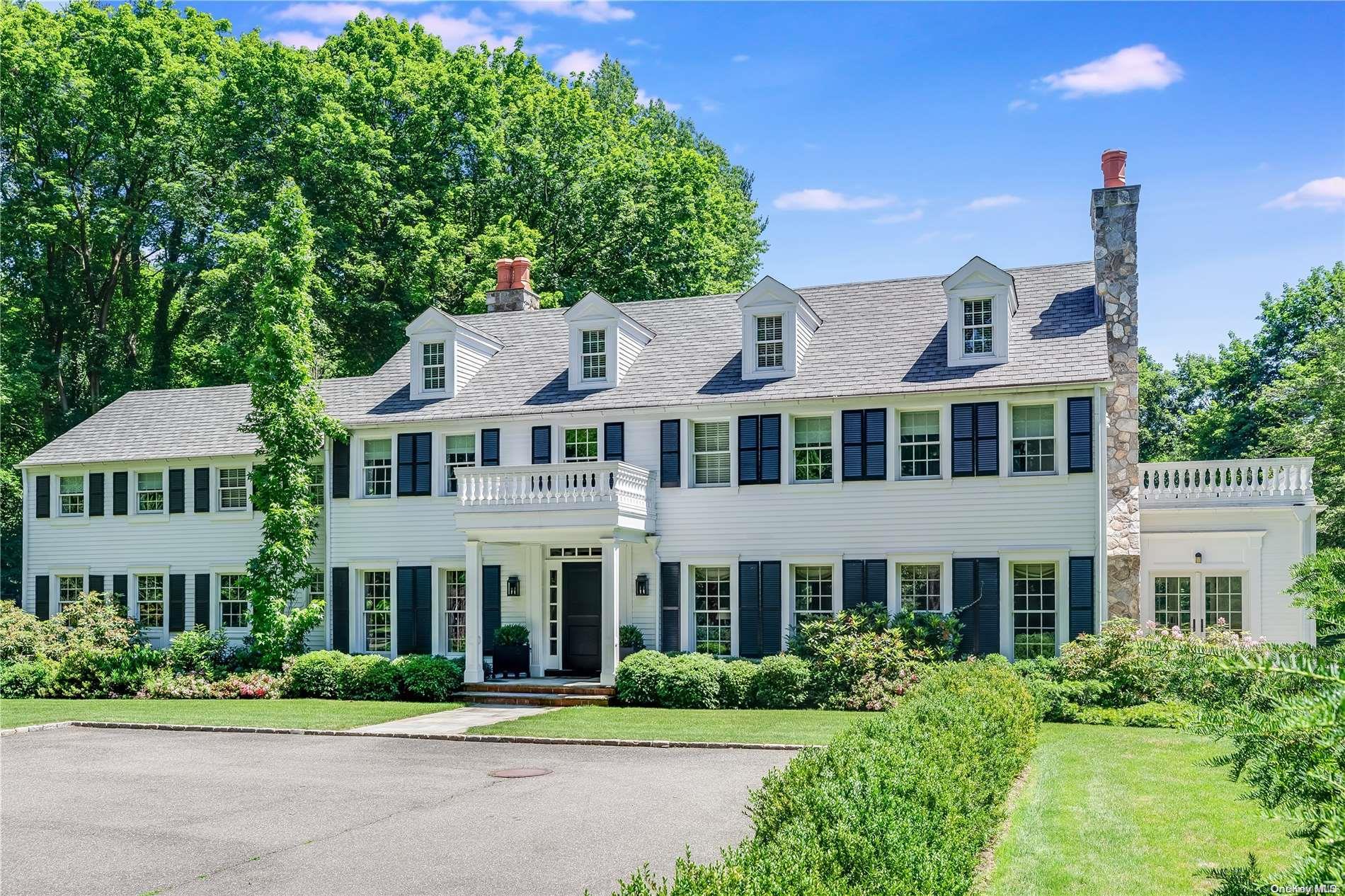 308 Duck Pond Road Locust Valley, NY 11560 - Photo 1 of 1 a front view of a residential houses with yard and green space
