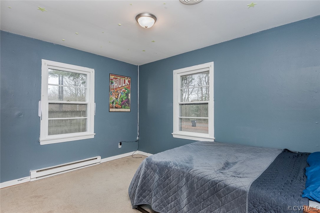9420 Townsend Road Providence Forge, VA 23140 - Photo 20 of 29 a bedroom with a bed and a window