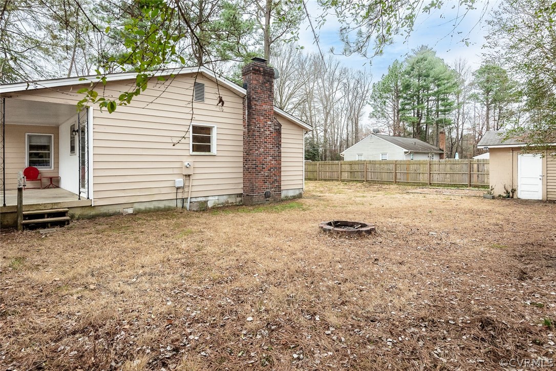 9420 Townsend Road Providence Forge, VA 23140 - Photo 24 of 29 a view of a house with backyard and sitting area
