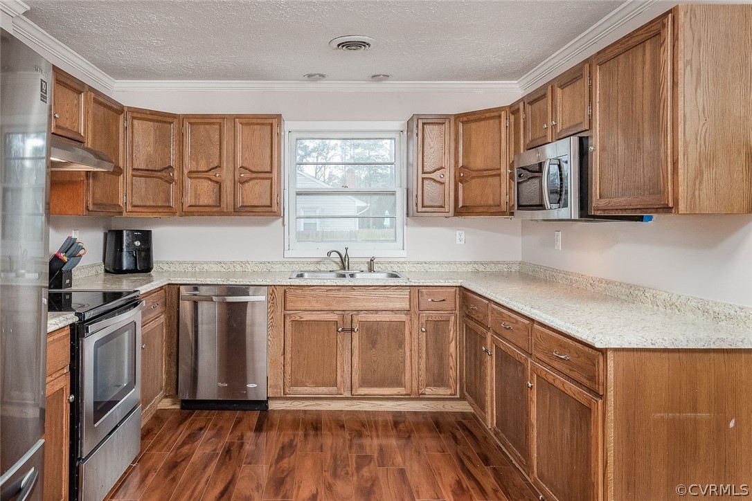 9420 Townsend Road Providence Forge, VA 23140 - Photo 8 of 29 a kitchen with stainless steel appliances granite countertop a stove a sink and a refrigerator