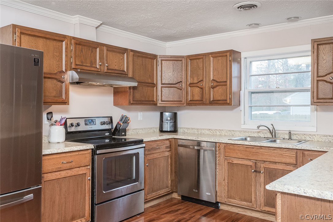 9420 Townsend Road Providence Forge, VA 23140 - Photo 9 of 29 a kitchen with stainless steel appliances granite countertop a sink stove and refrigerator