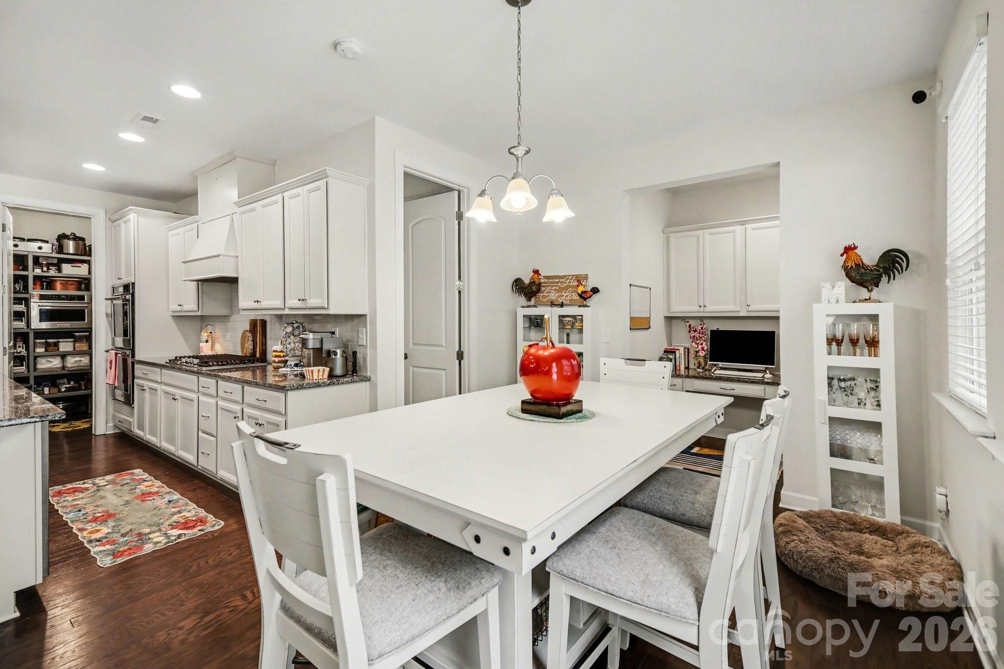 5327 Baker Lane Clover, SC 29710 - Photo 11 of 34 a kitchen with a dining table and chairs