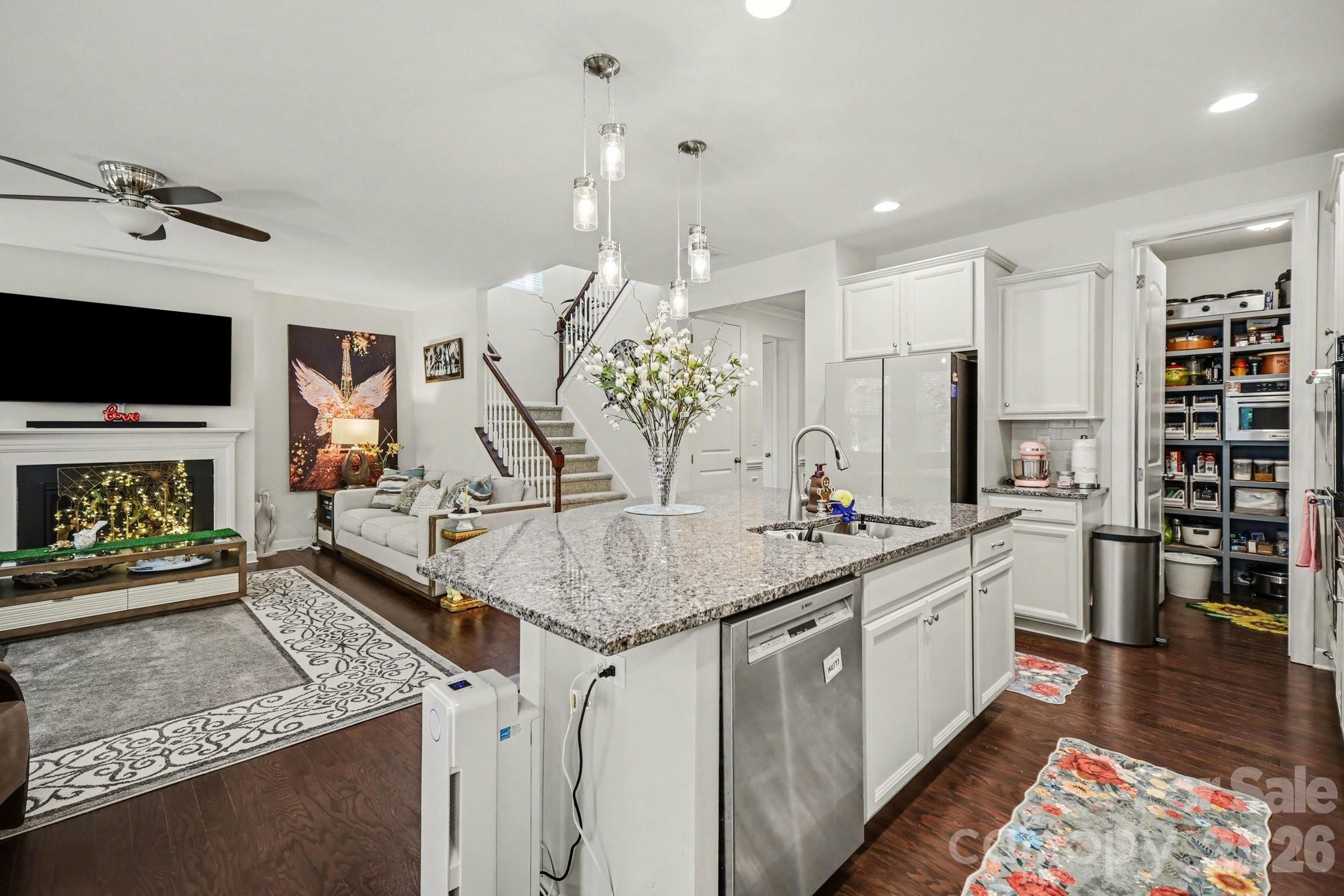 5327 Baker Lane Clover, SC 29710 - Photo 12 of 34 a kitchen with stainless steel appliances granite countertop a sink a stove and a wooden floors