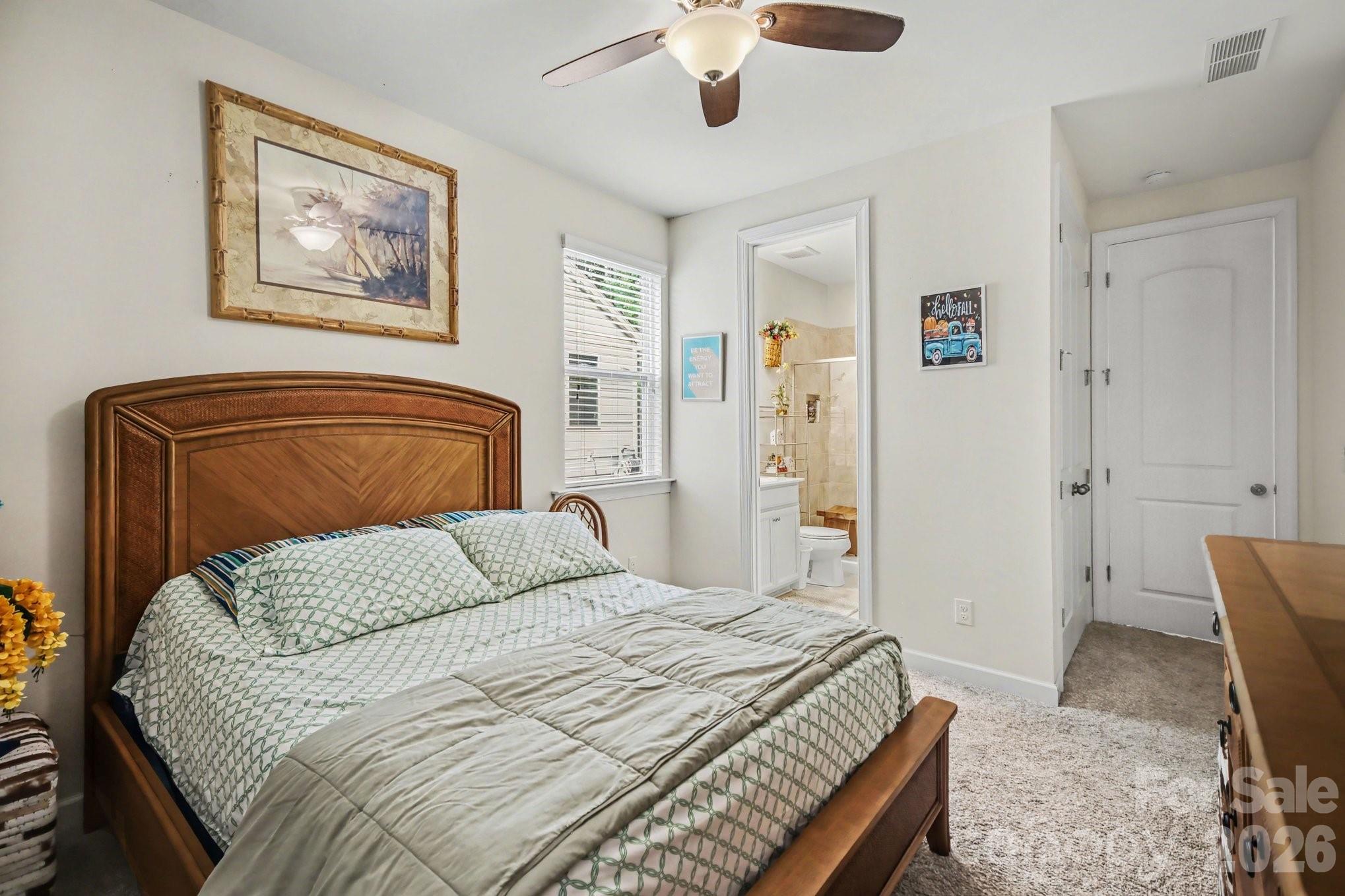 5327 Baker Lane Clover, SC 29710 - Photo 26 of 34 a bedroom with a bed and a painting on the wall
