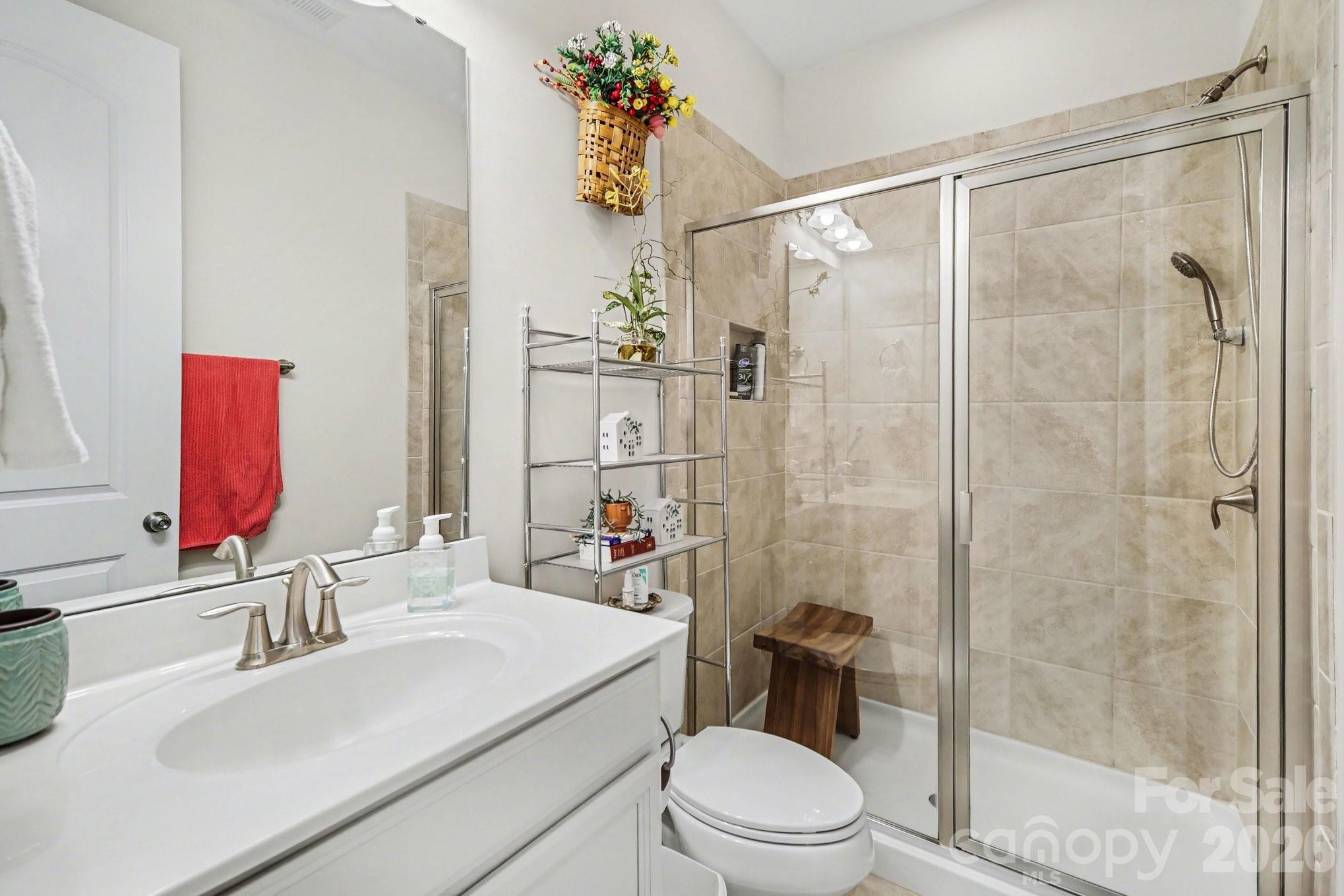 5327 Baker Lane Clover, SC 29710 - Photo 27 of 34 a bathroom with a sink toilet and shower