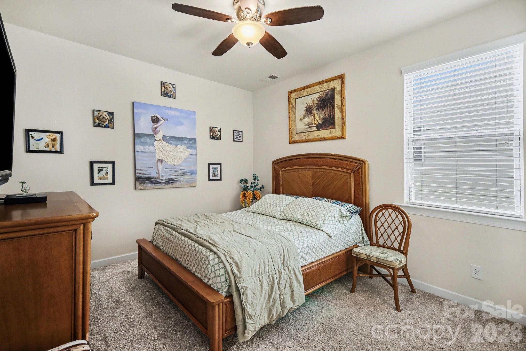 5327 Baker Lane Clover, SC 29710 - Photo 28 of 34 a bedroom with a bed and a chair