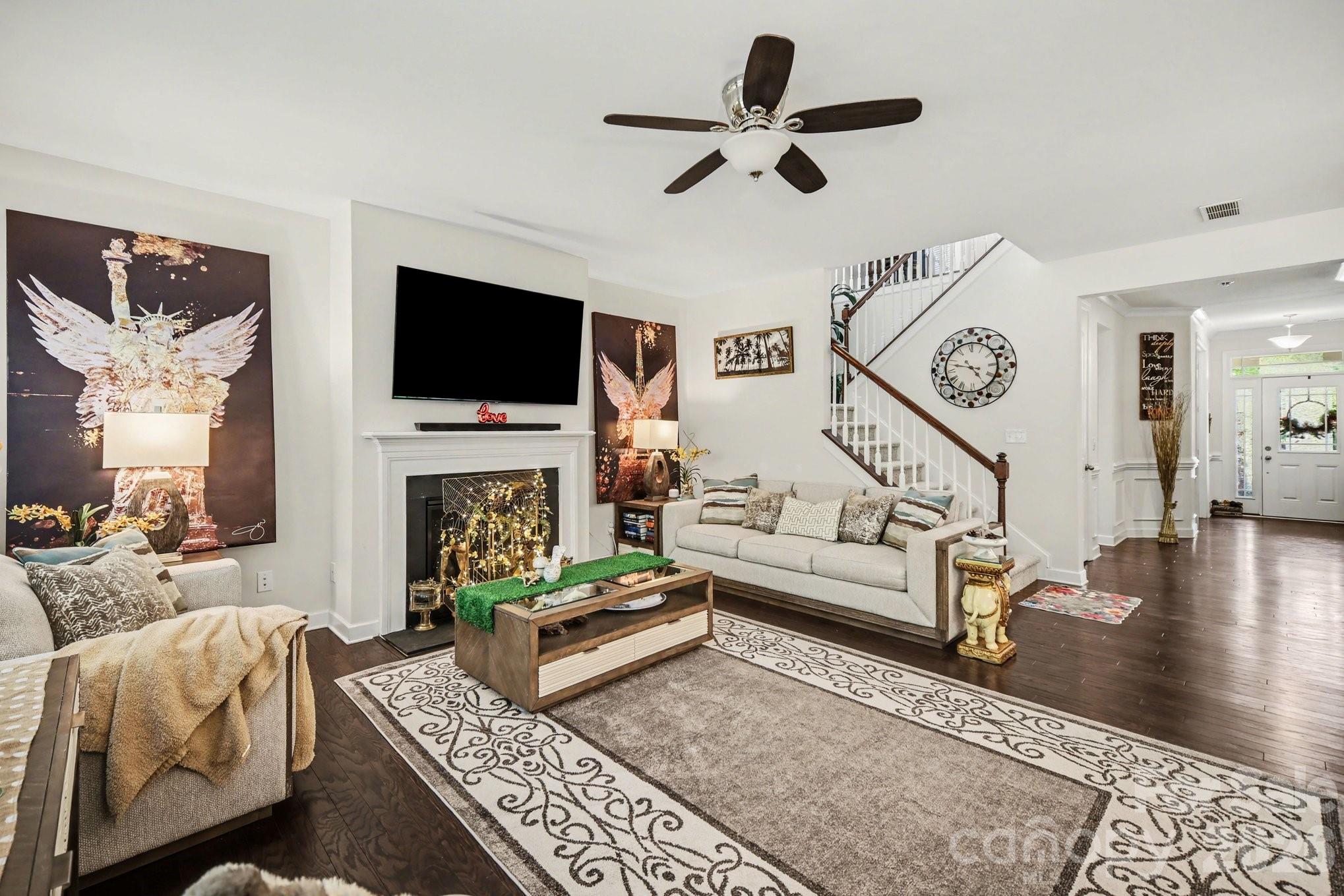 5327 Baker Lane Clover, SC 29710 - Photo 5 of 34 a living room with furniture a fireplace and a flat screen tv