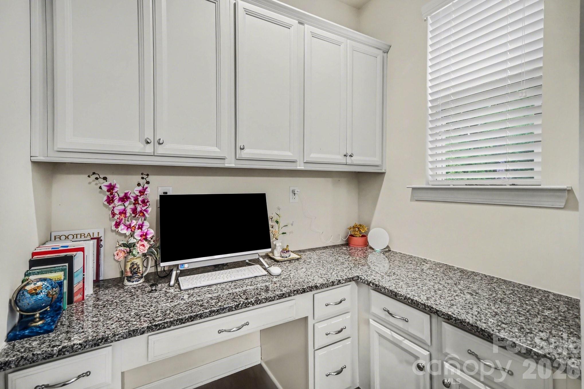 5327 Baker Lane Clover, SC 29710 - Photo 8 of 34 a kitchen with granite countertop a sink stainless steel appliances and a microwave