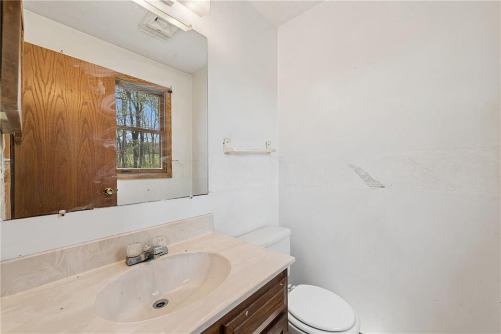 136 Bottom Road Mill Run, PA 15464 - Photo 9 of 26 a bathroom with a sink toilet and shower