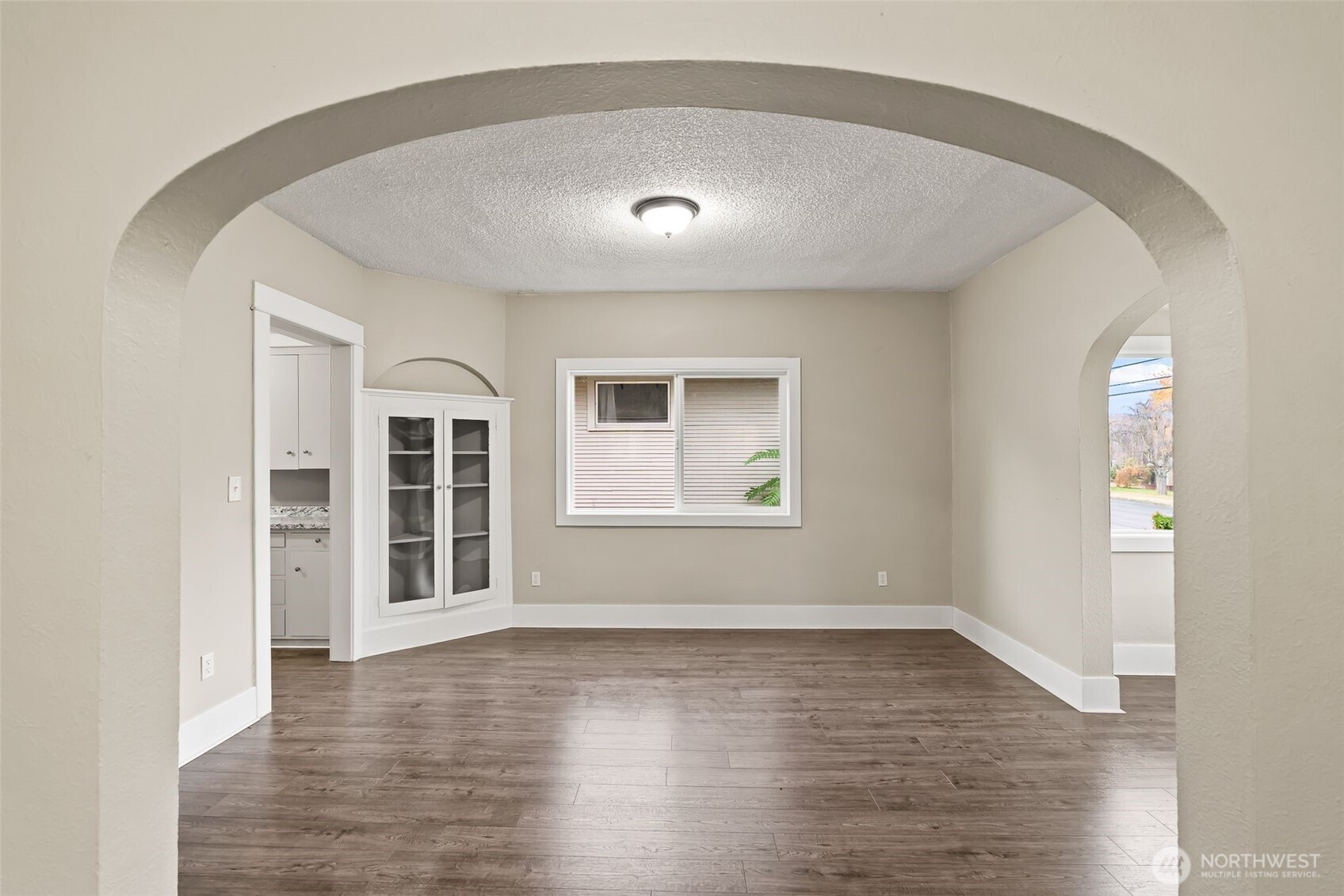 2214 Summitview Avenue Yakima, WA 98902 - Photo 9 of 30 an empty room with wooden floor and windows