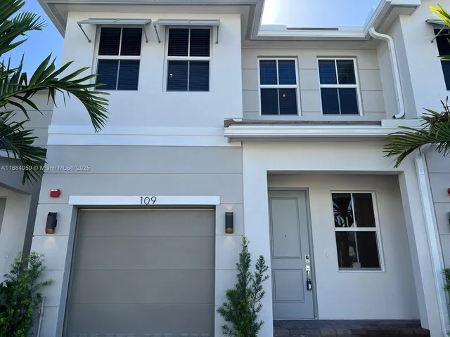 a living room with a potted plant