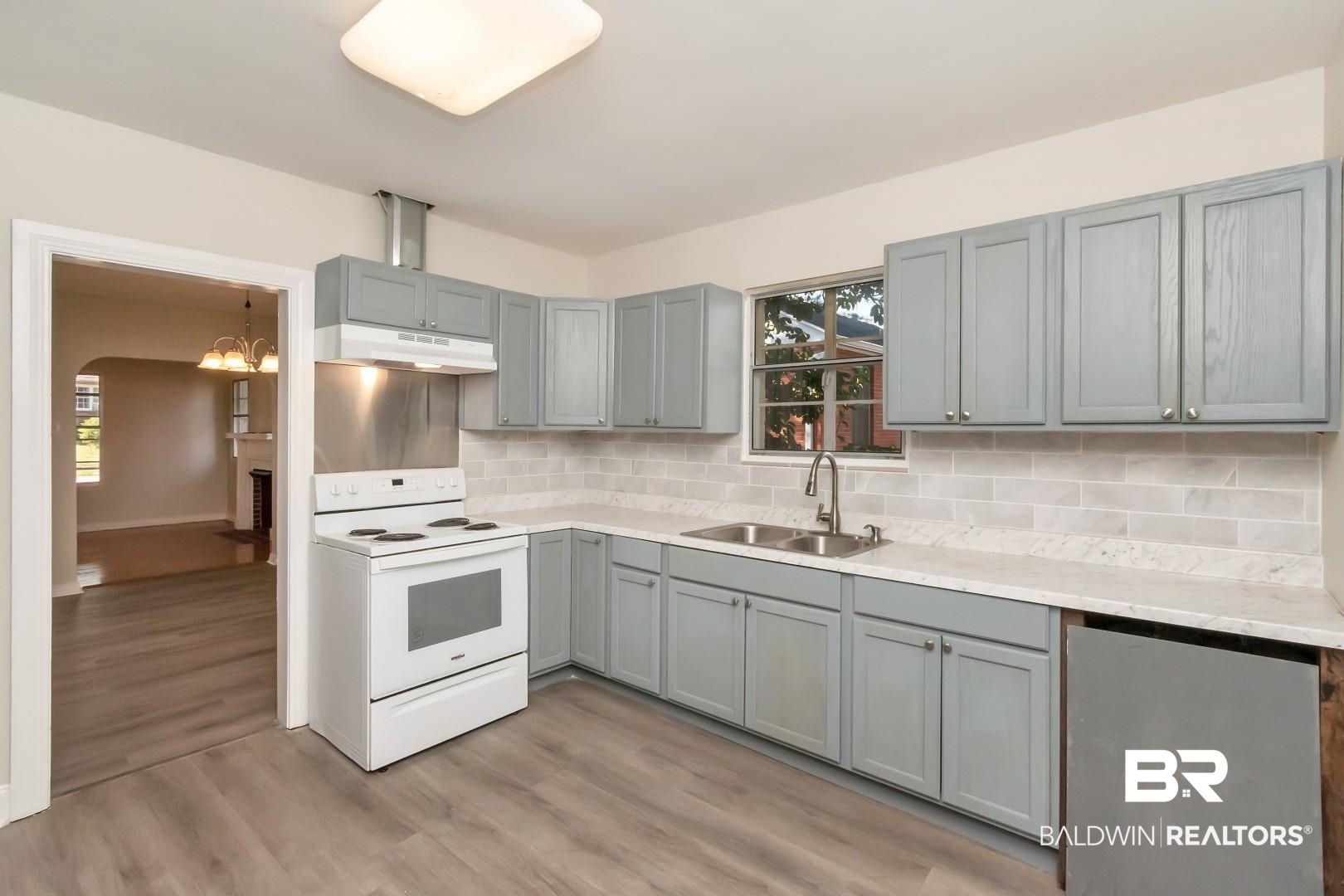 292 Siena Vista Street Mobile, AL 36607 - Photo 5 of 30 Kitchen with white range with electric cooktop, gray cabinets, light countertops, a sink, and under cabinet range hood