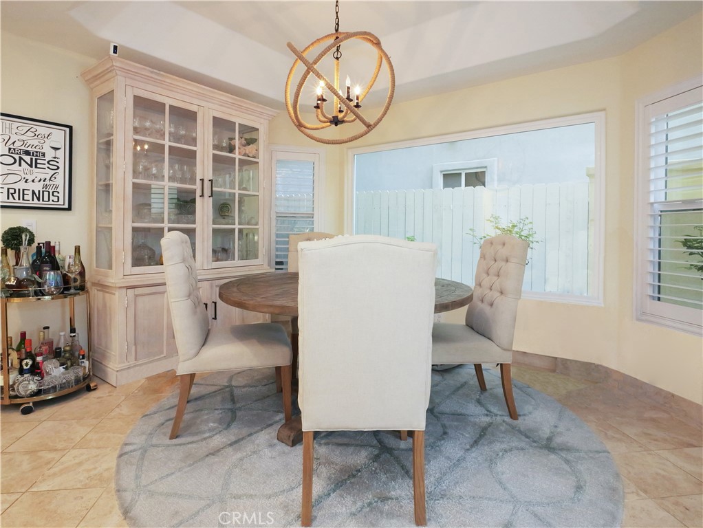 320 15th Street Huntington Beach, CA 92648 - Photo 14 of 49 a living room with furniture a window and a clock