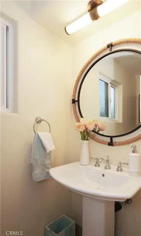 a bathroom with a sink and mirror