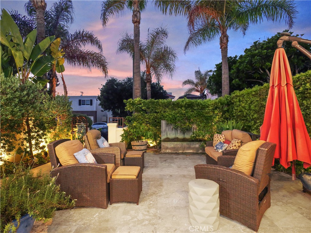 320 15th Street Huntington Beach, CA 92648 - Photo 5 of 49 a view of a backyard with swimming pool and furniture