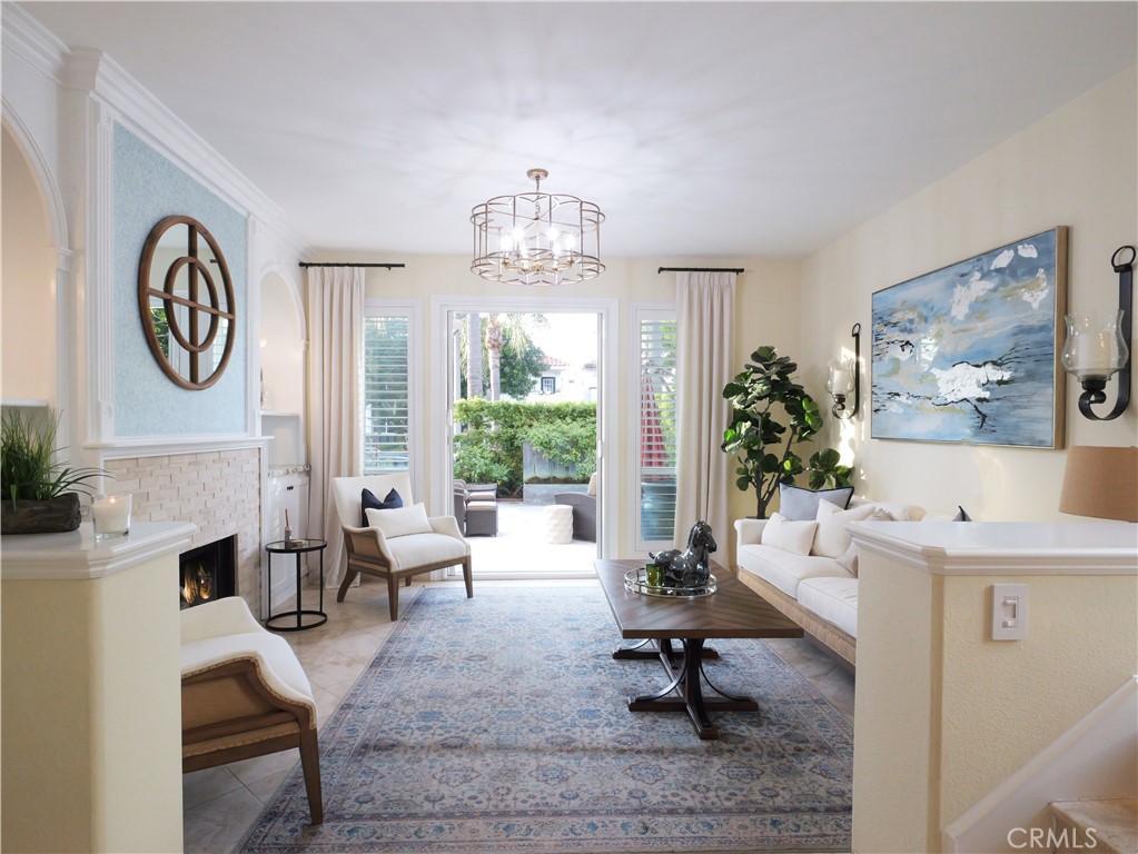 320 15th Street Huntington Beach, CA 92648 - Photo 9 of 49 a living room with furniture a clock and a large window