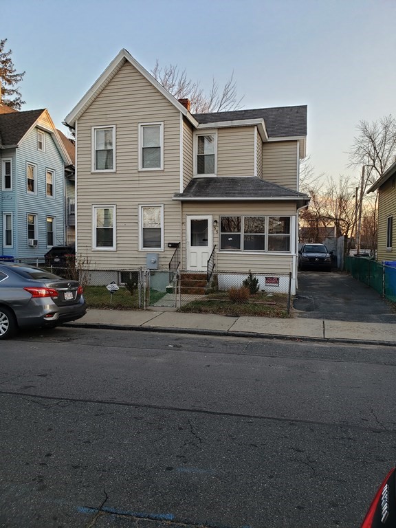 55 Tyler Street Springfield, MA 01109 - Photo 1 of 32 a front view of a house with a yard