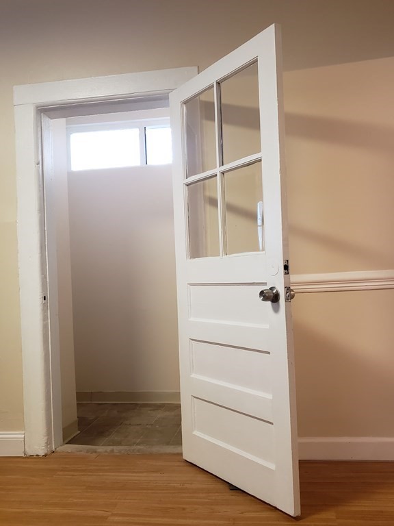 55 Tyler Street Springfield, MA 01109 - Photo 20 of 32 a view of walk in closet with empty racks